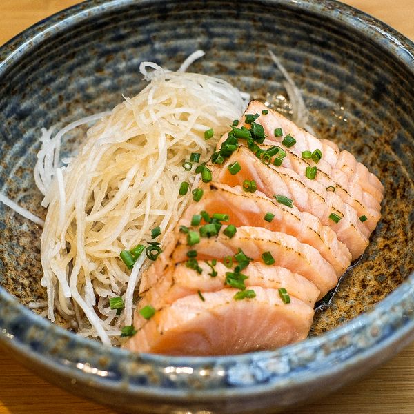 Salmon Tataki. Sliced ​​and braised salmon, daikon oroshi, ponzu sauce and chives. 8.5 EUR. Japanese, Sushi, Asian