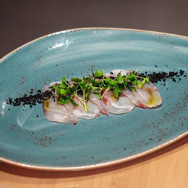 Shiro Usuzukuri. Thinly sliced ​​sea bass with DOP olive oil, olive powder and fleur de sel. 9.5 EUR. Japanese, Sushi, Asian